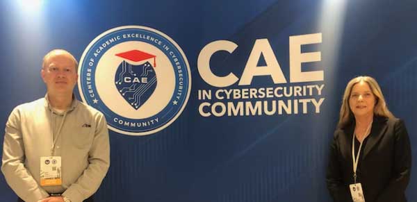 Dr. Kembley Lingelbach and Dr. Kevin Floyd attend the annual 2024 CAE in Cybersecurity Symposium.